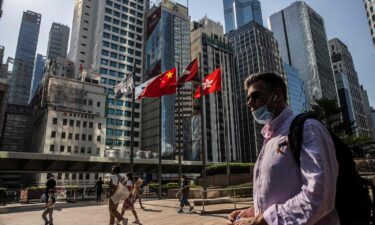 People walk through Exchange Square in Hong Kong on October 28