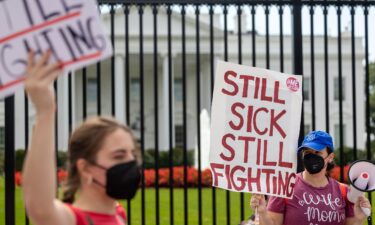 Protestors march outside the White House on September 19