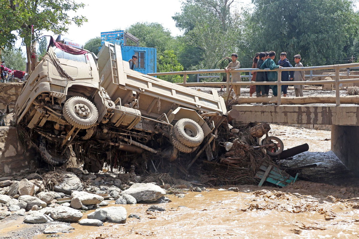 <i>AP</i><br />An excavator removes mud and rocks from a damaged house after heavy flooding in Maidan Wardak province.