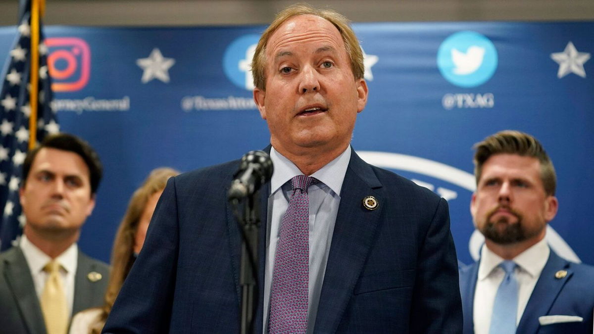 <i>Eric Gay/AP/FILE</i><br/>Texas state Attorney General Ken Paxton reads a statement at his office in Austin