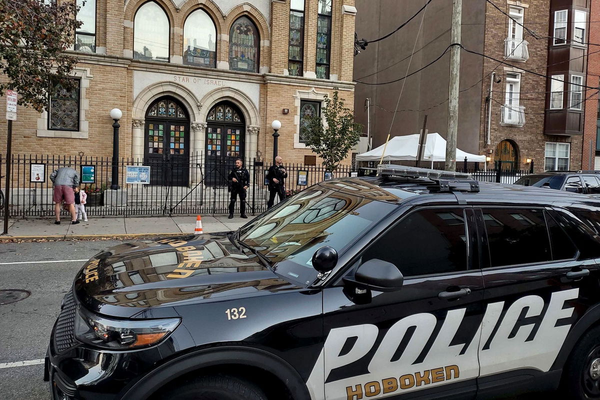 <i>Ryan Kryska/AP</i><br/>Police officers are pictured outside the United Synagogue of Hoboken