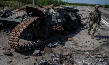 Ukrainian soldiers ride a tank near Robotyne