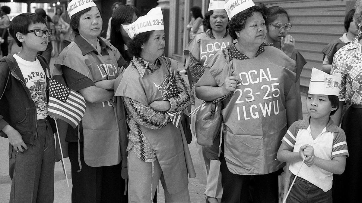 Members of the International Ladies Garment Workers Union stand on 5th Avenue during the Labor Day Parade, in New York, on September 6, 1982.
