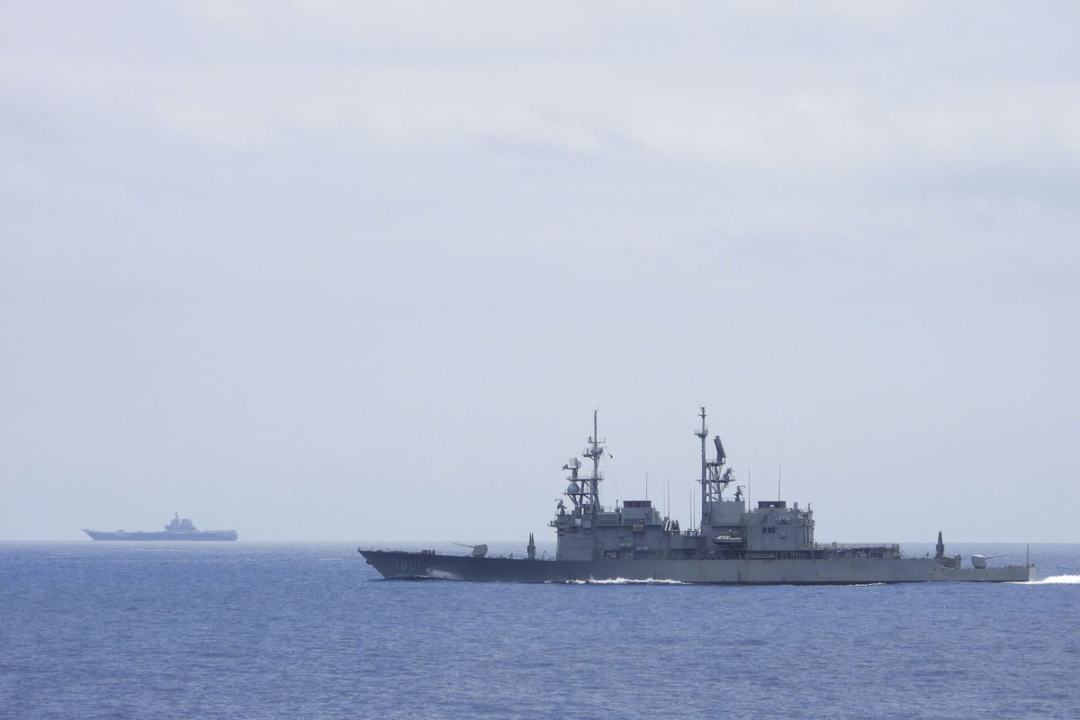 <i>AP</i><br/>This photo released by Taiwan's Ministry of National Defense shows a Taiwanese navy ship monitoring the Chinese aircraft carrier