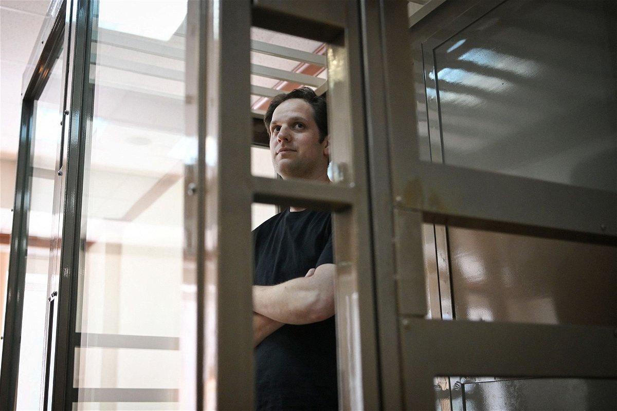 <i>Natalia Kolesnikova/AFP/Getty Images/File</i><br/>Evan Gershkovich stands inside a defendants' cage before a hearing in Moscow on June 22.