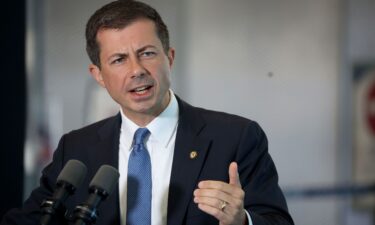 Secretary of Transportation Pete Buttigieg speaks to reporters at O'Hare International Airport