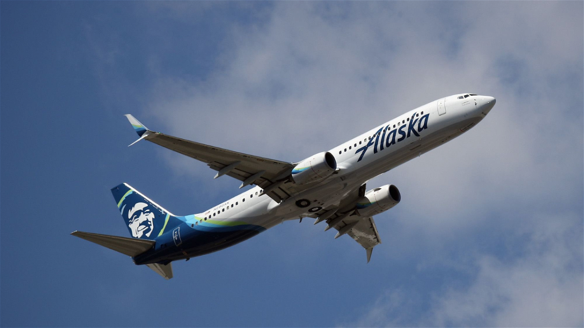 A Boeing 737-990 operated by Alaska Airlines takes off from JFK Airport in August 2019. An off-duty pilot who was riding in the cockpit of an Alaska Airlines flight en route to San Francisco on October 22 is facing dozens of attempted murder charges.