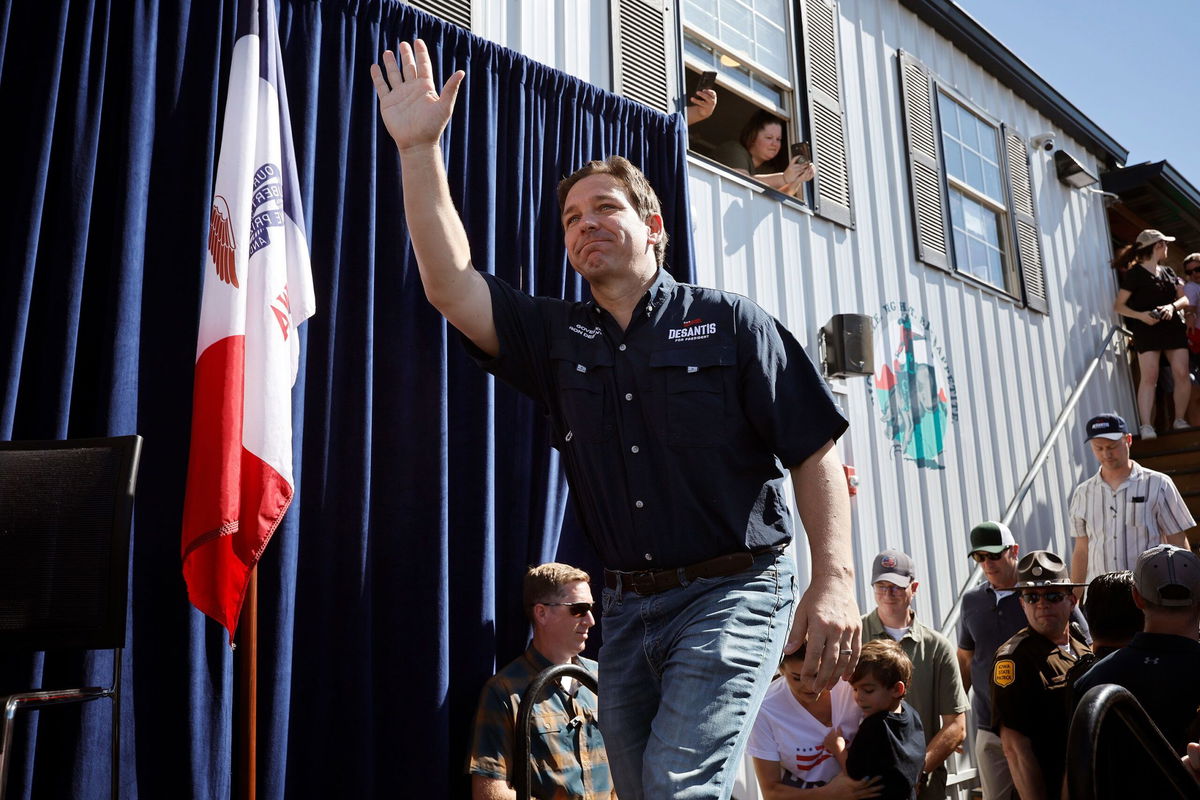 <i>Chip Somodevilla/Getty Images</i><br/>Florida Gov. Ron DeSantis takes the stage during one of Iowa Gov. Kim Reynolds' 