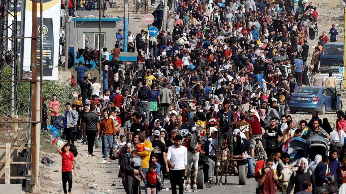 Palestinians fleeing north Gaza walk towards the south
