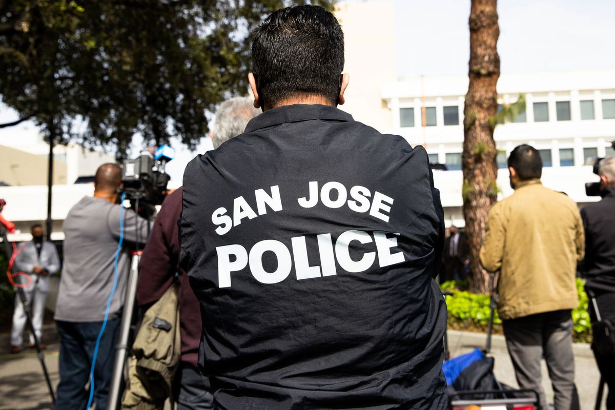 <i>Randy Vazquez/MediaNews Group/The Mercury News/Getty Images</i><br />A person wears a San Jose Police jacket during a news conference outside the San Jose Police department in San Jose