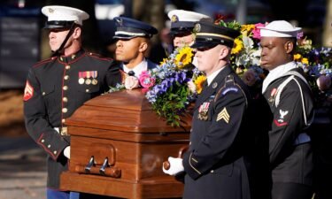 A military team carries the casket of former first lady Rosalynn Carter upon arrival at the Jimmy Carter Presidential Library and Museum