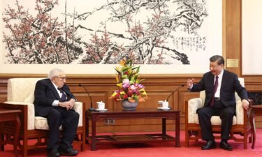 China's leader Xi Jinping (R) speaks with former US secretary of state Henry Kissinger during a meeting in Beijing on July 20.