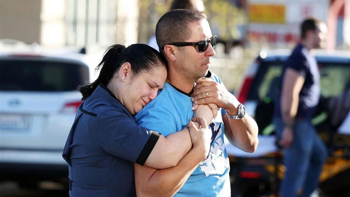 Parents Mabel Fontanilla and Raul Villalonga embrace after a shooting at the University of Nevada
