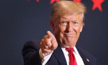 Republican presidential candidate former President Donald Trump arrives for a rally on October 07