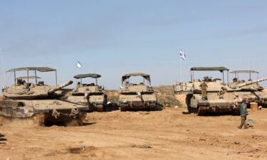 Palestinian search and rescue teams respond to an Israeli attack on Al-Maghazi refugee camp in central Gaza after the truce expired