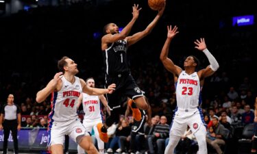 Brooklyn Nets forward Mikal Bridges drives to the basket against Detroit Pistons forward Bojan Bogdanovic and guard Jaden Ivey during the first half of Saturday's game in New York.