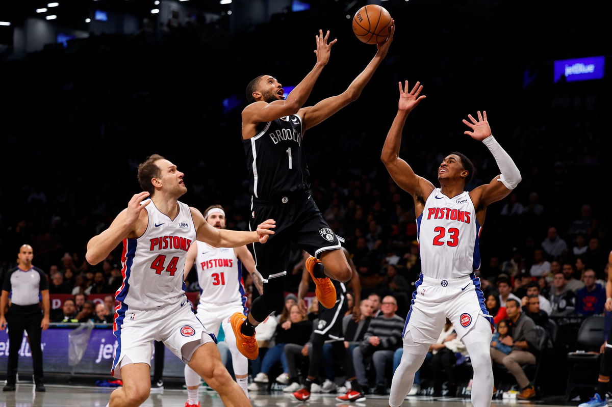 <i>Noah K. Murray/AP</i><br/>Brooklyn Nets forward Mikal Bridges drives to the basket against Detroit Pistons forward Bojan Bogdanovic and guard Jaden Ivey during the first half of Saturday's game in New York.