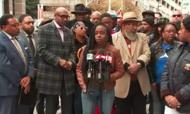 Supporters of a deacon who died after being tased during an arrest rallied for justice outside the Fulton County Courthouse.