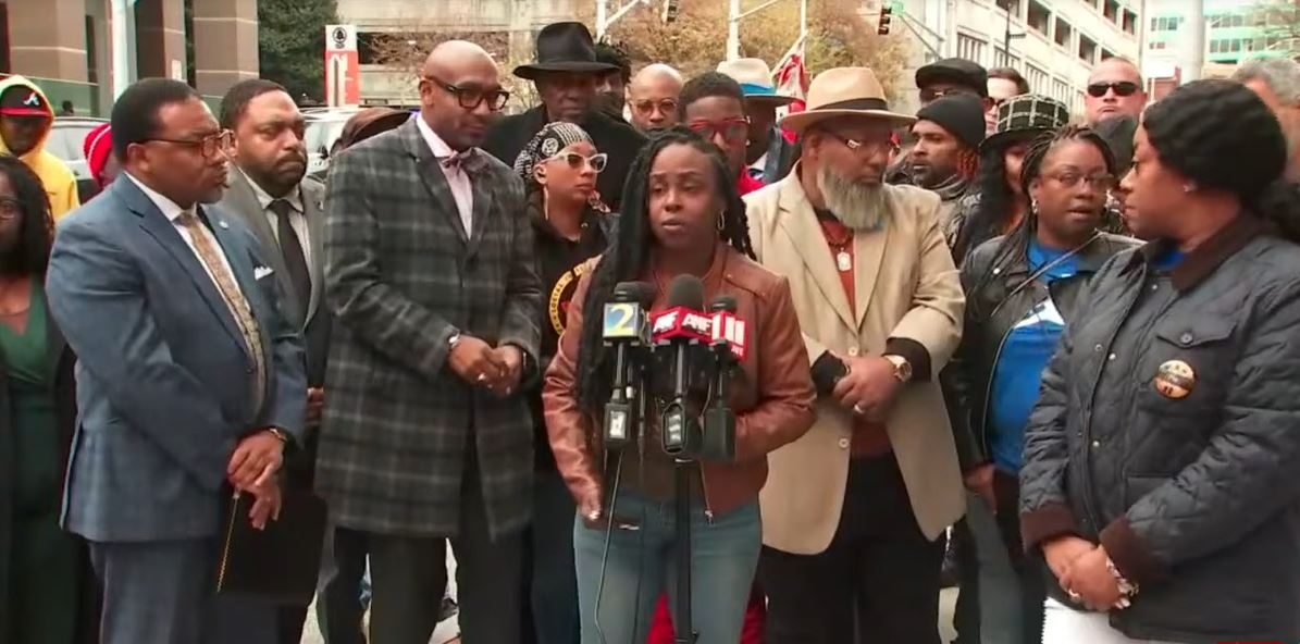 <i></i><br/>Supporters of a deacon who died after being tased during an arrest rallied for justice outside the Fulton County Courthouse.