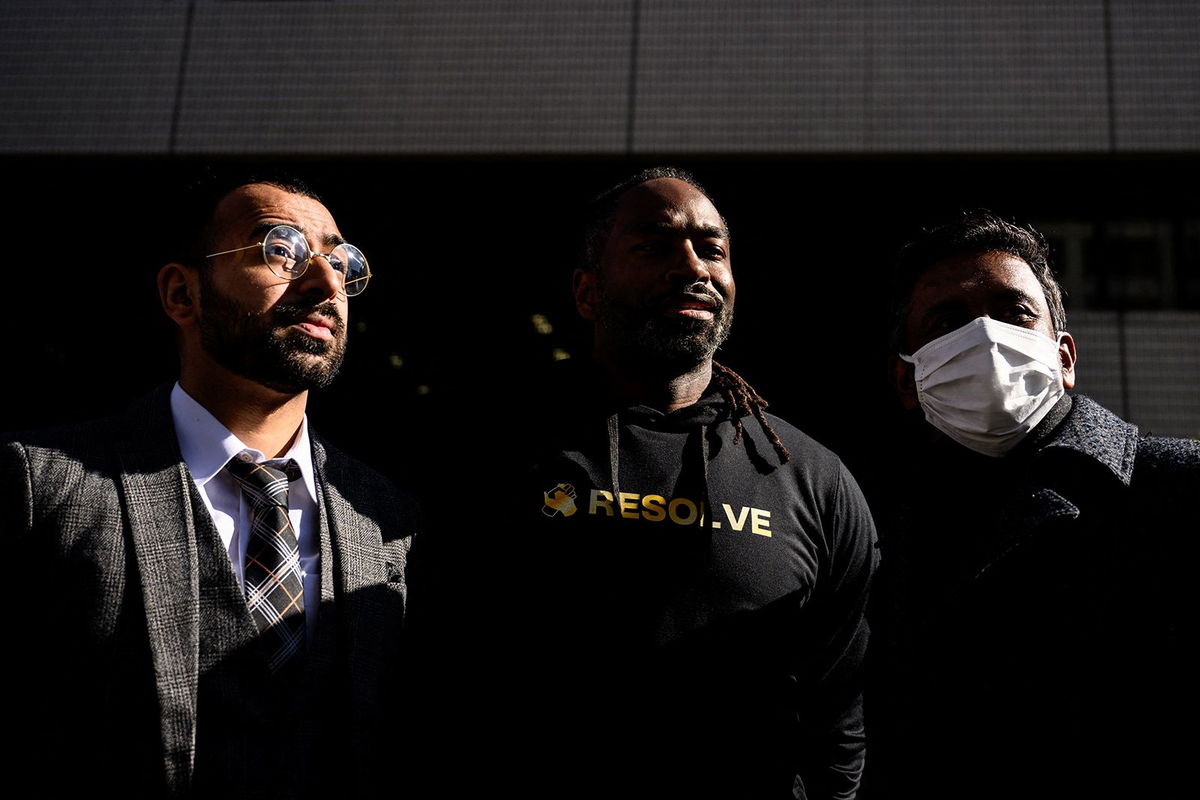 <i>Philip Fong/AFP/Getty Images</i><br/>The three plaintiffs and their legal team walk outside the Tokyo District Court on January 29