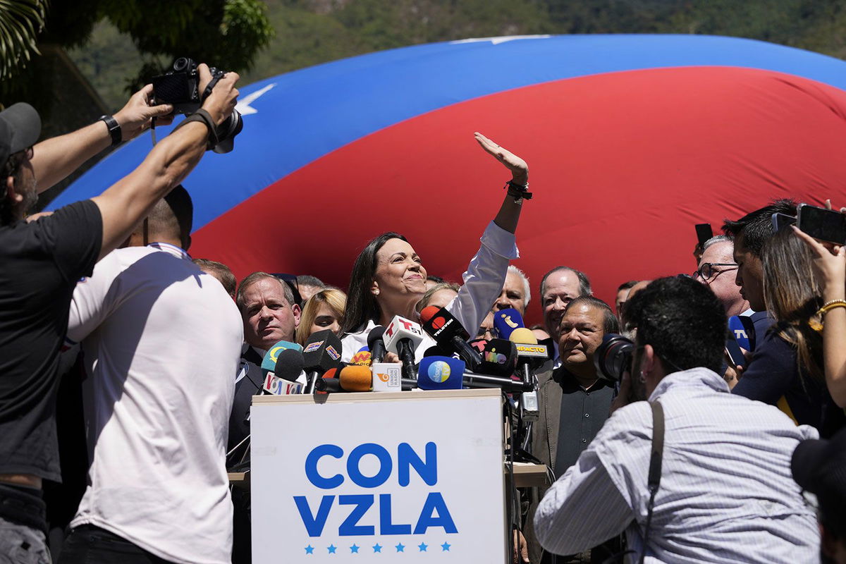 <i>Ariana Cubillos/AP</i><br/>Opposition coalition presidential hopeful Maria Corina Machado gives a press conference outside her campaign headquarters in Caracas