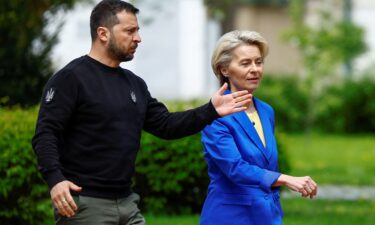 Ukraine's President Volodymyr Zelensky walks with European Commission President Ursula von der Leyen to a joint press conference in Kyiv on Tuesday.