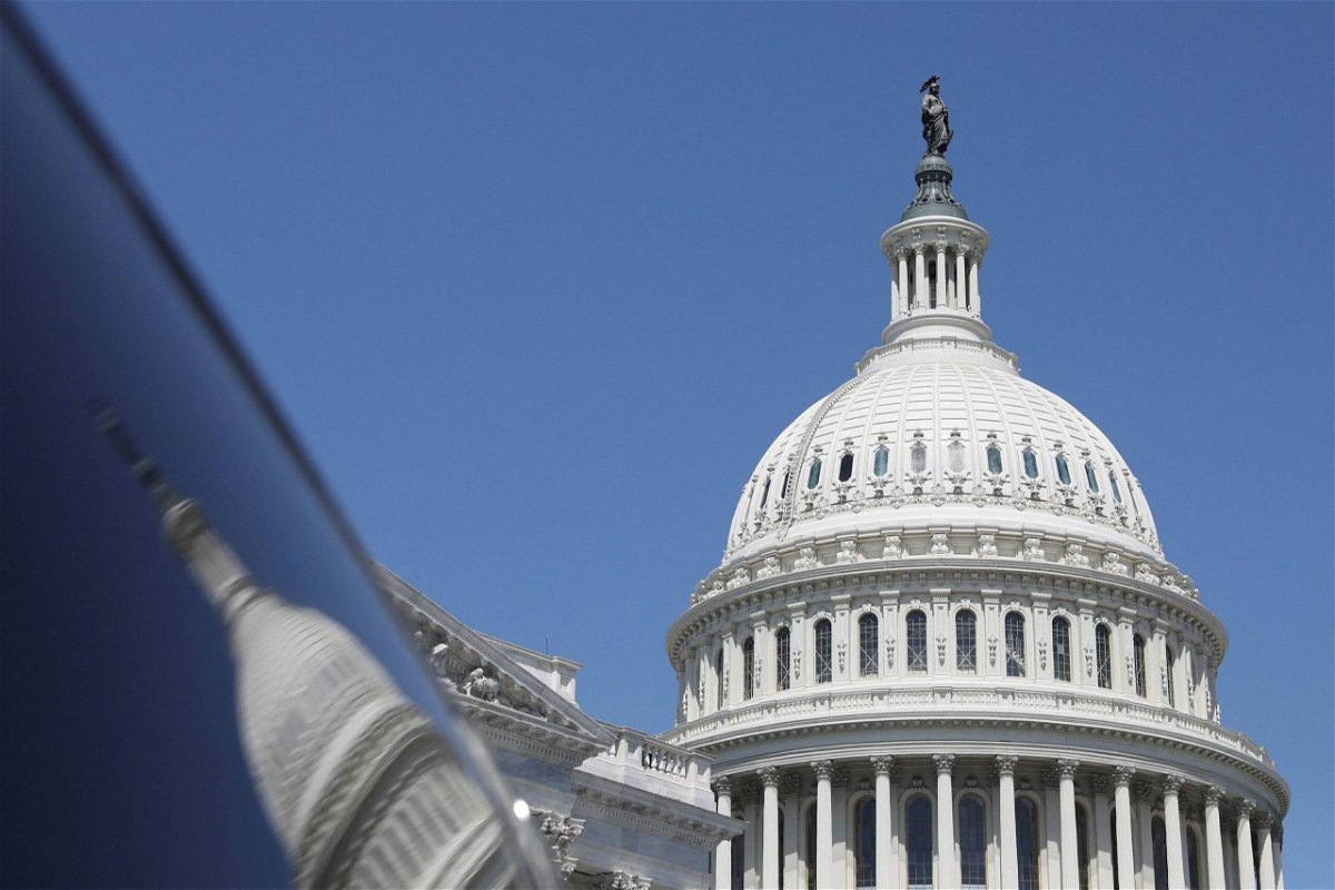<i>Amanda Andrade-Rhoades/Reuters</i><br/>The dome of the US Capitol is reflected in a window on Capitol Hill in Washington