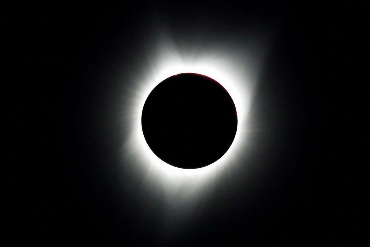 <i>Adrees Latif/Reuters via CNN Newsource</i><br/>The 2017 total solar eclipse is seen over Mitchell