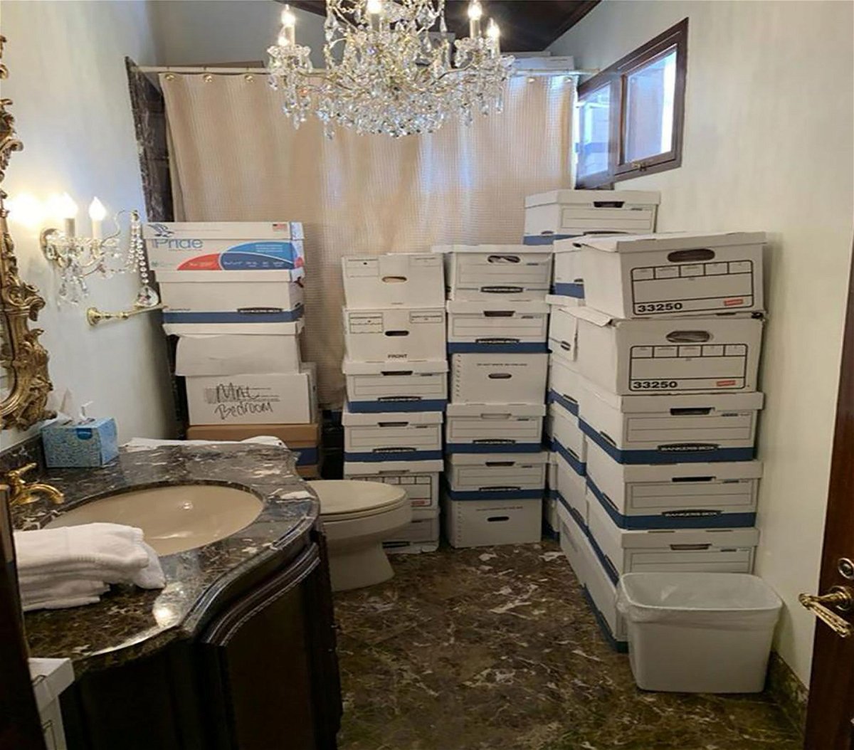 <i>US Department of Justice via CNN Newsource</i><br/>This photo from the US Justice Department shows boxes of classified documents stored in a bathroom and shower in the Mar-a-Lago Club.