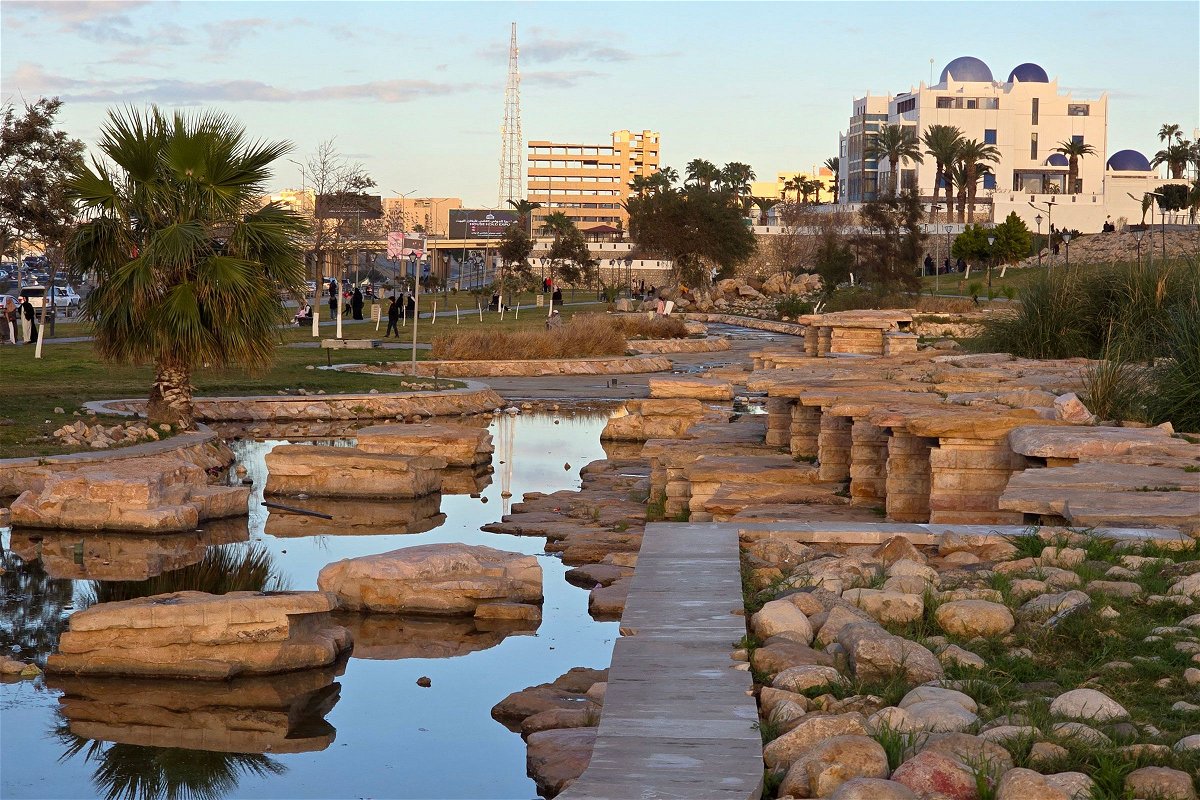 <i>Mahmud Turkia/AFP/Getty Images via CNN Newsource</i><br/>People walk near a park along the seaside corniche in Libya's capital Tripoli on February 22.
