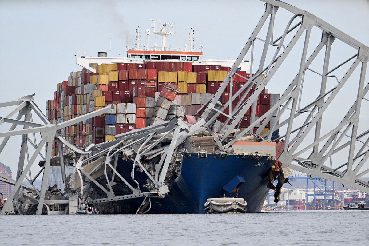 	The steel frame of the Francis Scott Key Bridge sits on top of the container ship Dali after the bridge collapsed, Baltimore, Maryland, on March 26.