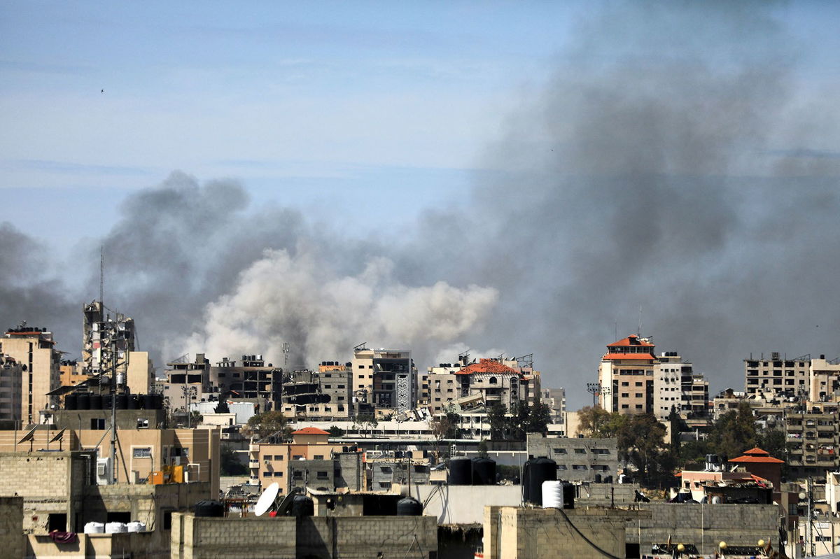 <i>Dawoud Abo Alkas/Anadolu/Getty Images via CNN Newsource</i><br/>Palestinian residents leave the area with a few items after Israeli forces besiege the Al-Shifa hospital with tanks and heavy gunfire in Gaza City