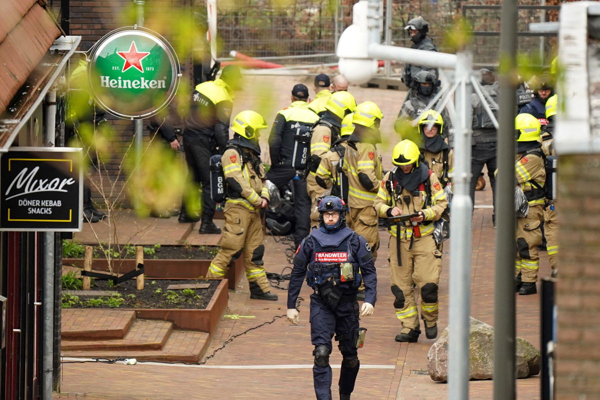 <i>Persbureau Heitink/AFP/Getty Images via CNN Newsource</i><br/>Police and emergency services are seen amid the hostage incident in Ede on Saturday.