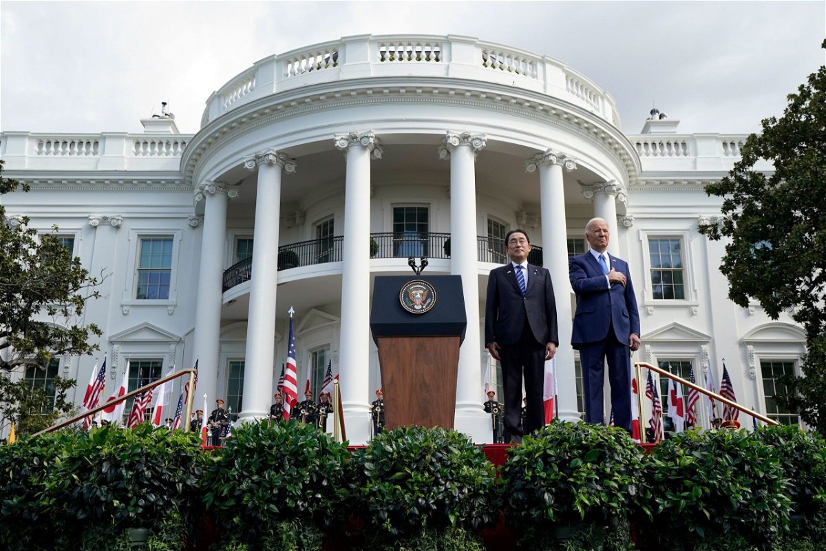 <i>Alex Brandon/AP via CNN Newsource</i><br/>President Joe Biden and Japanese Prime Minister Fumio Kishida listen to the National Anthem during a State Arrival Ceremony on the South Lawn of the White House