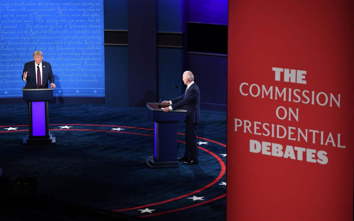 <i>Saul Loeb/AFP/Getty Images via CNN Newsource</i><br/>Joe Biden and Donald Trump take part in a presidential debate in Cleveland