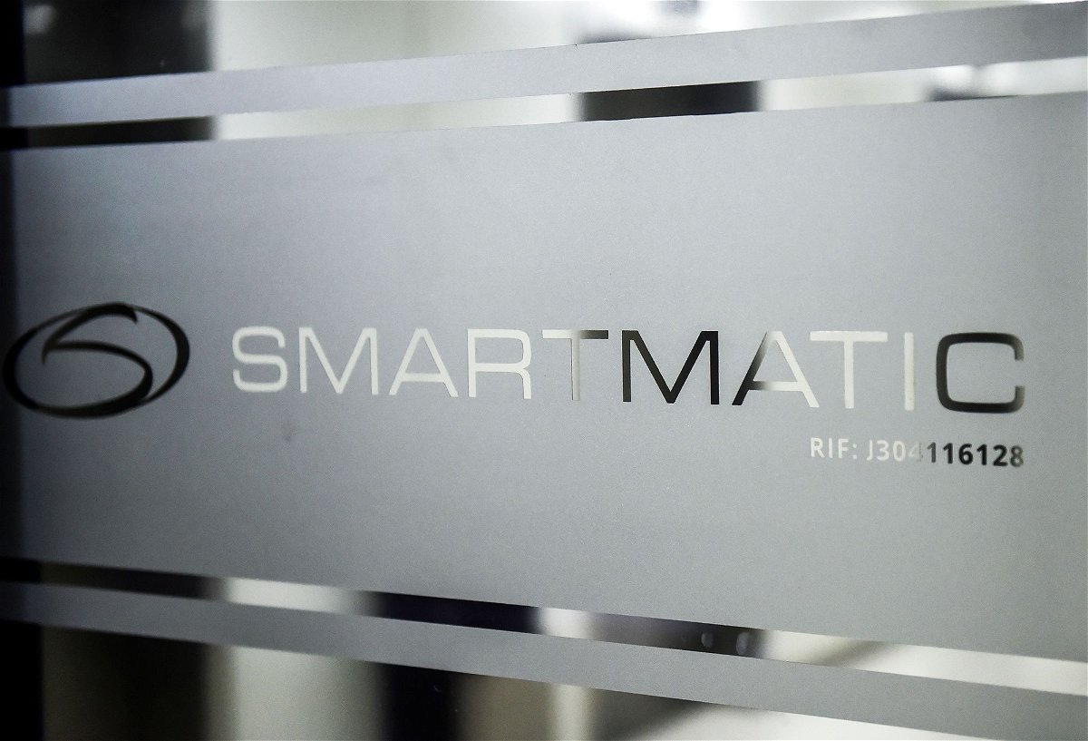 <i>Ronaldo Schemidt/AFP/Getty Images via CNN Newsource</i><br/>Picture of the logo of Smartmatic. The voting machine company's defamation case against right-wing cable channel Newsmax over the 2020 election has now been scheduled to go to trial in September.