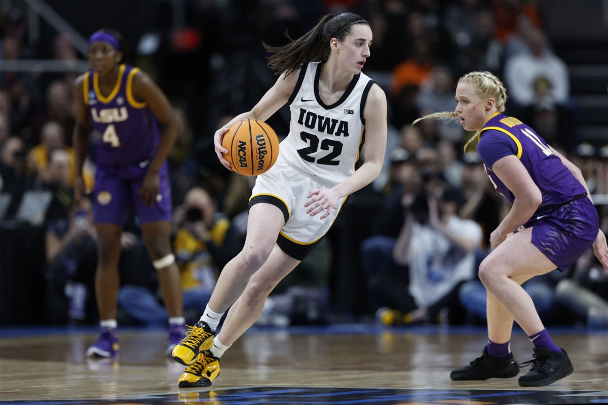 <i>Sarah Stier/Getty Images via CNN Newsource</i><br/>Caitlin Clark of the Iowa Hawkeyes dribbles against Hailey Van Lith of the LSU Tigers at last Monday's NCAA Women's basketball game in Albany
