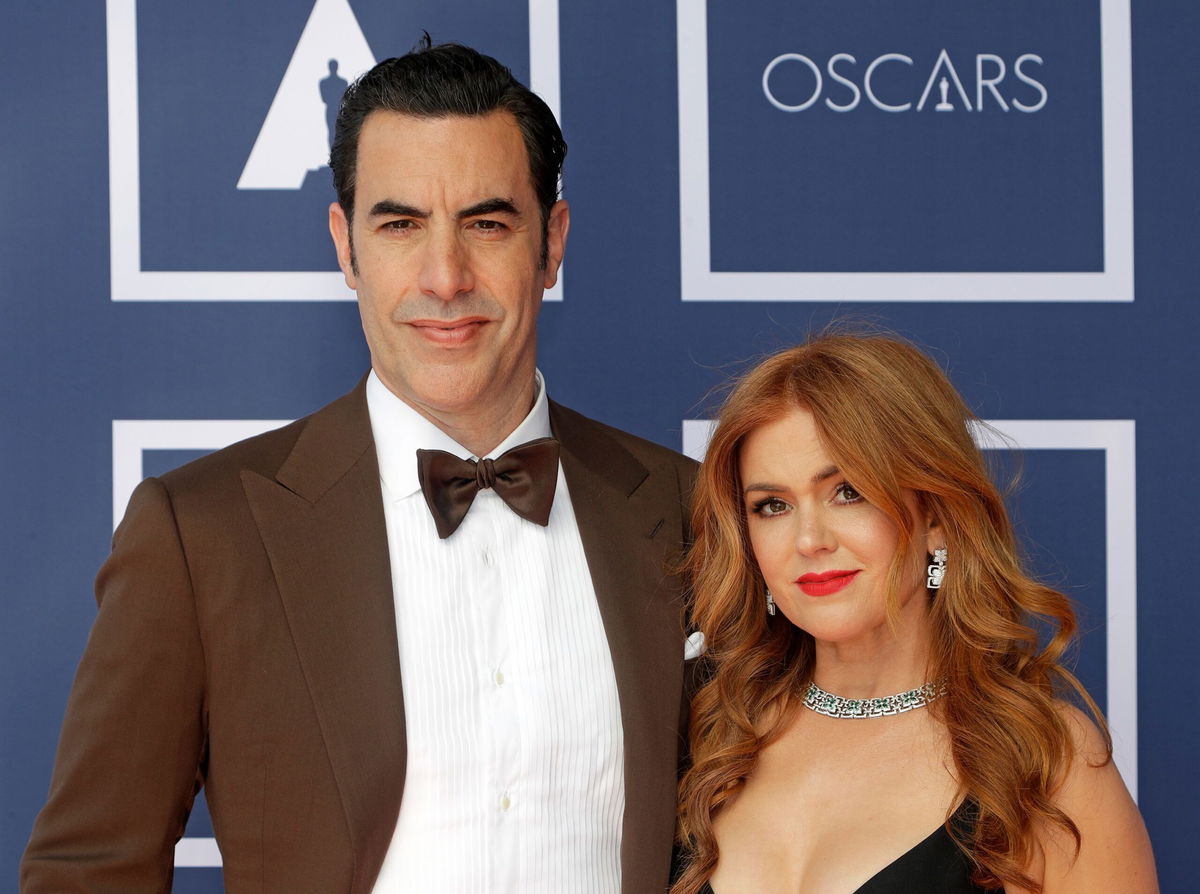 <i>Rick Rycroft/AP via CNN Newsource</i><br/>Sacha Baron Cohen and Isla Fisher