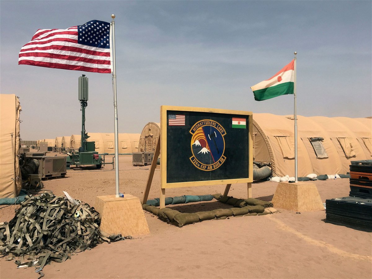 A U.S. and Niger flag are raised side by side at the base camp for air forces and other personnel supporting the construction of Niger Air Base 201 in Agadez