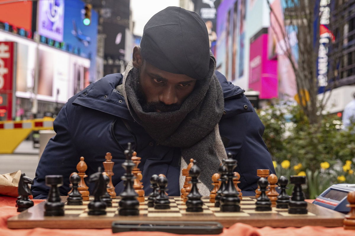 <i>Yuki Iwamura/AP via CNN Newsource</i><br />People celebrate as Tunde Onakoya marks 46 hours for consecutively playing a chess game in Times Square