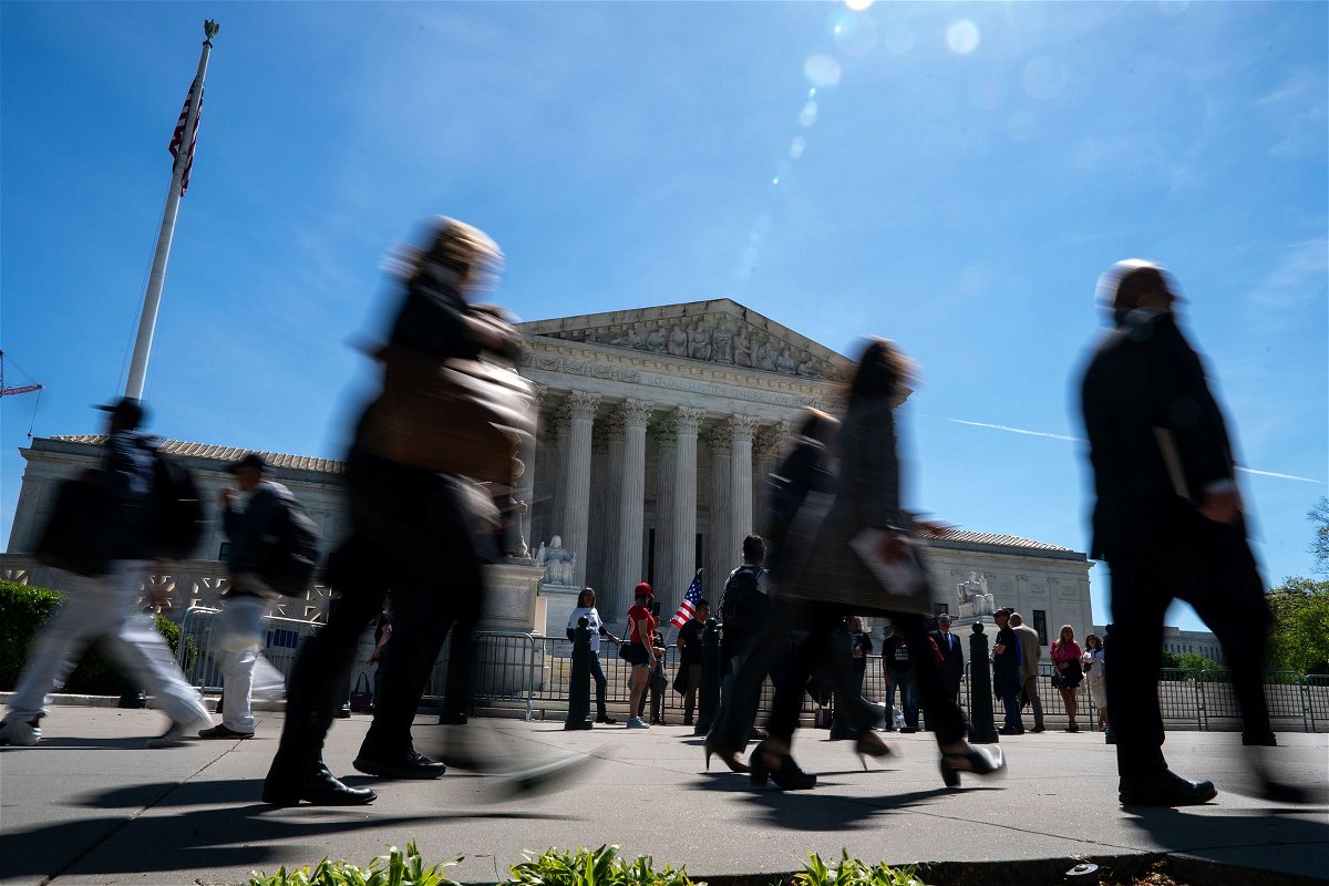<i>Kent Nishimura/Getty Images via CNN Newsource</i><br/>People walk outside of the Supreme Court on April 16