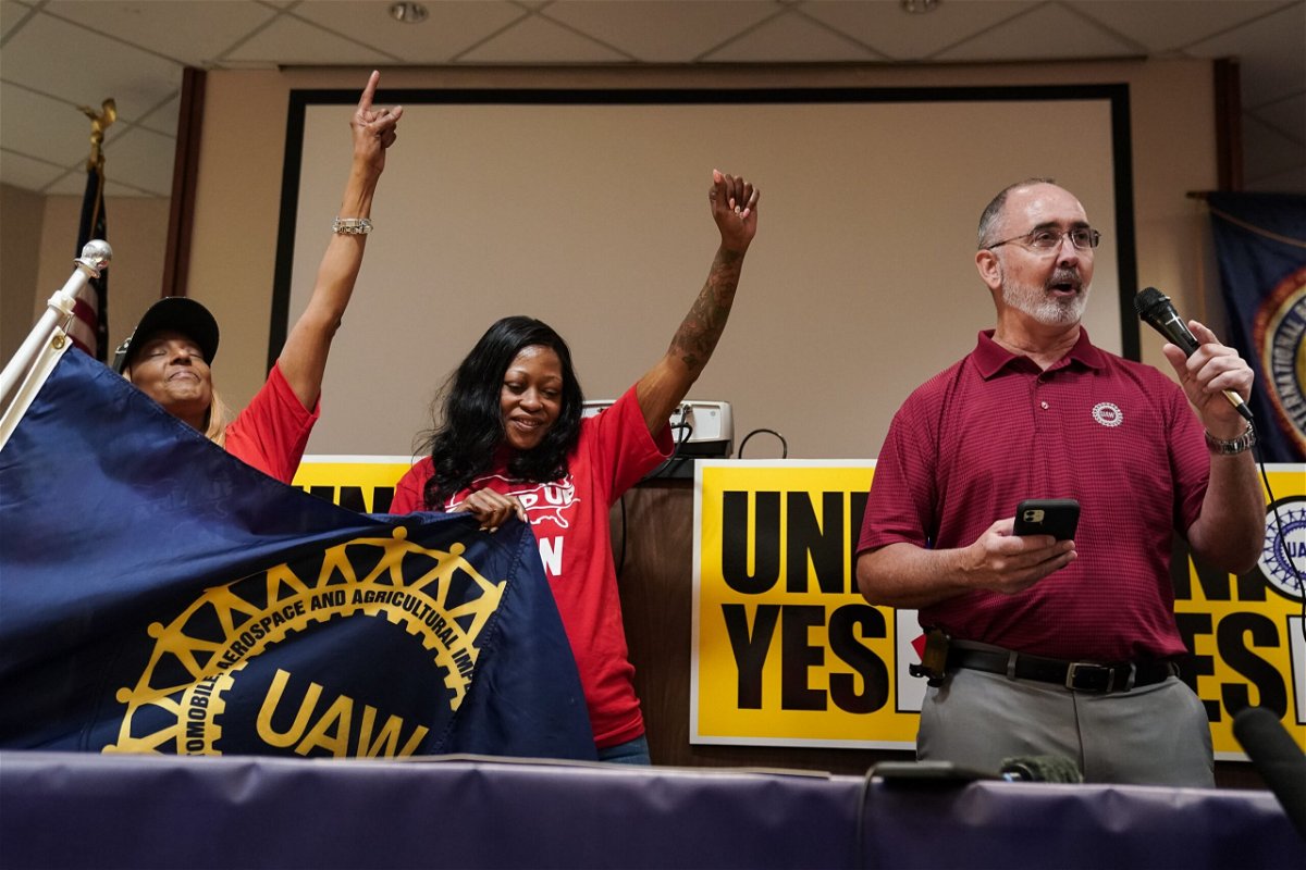 <i>George Walker IV/AP via CNN Newsource</i><br/>Volkswagen automobile plant employees celebrate winning a vote to join the UAW union Friday
