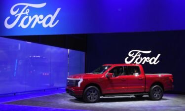 Ford unveils the new F-150 Lightning electric pickup during a Los Angeles auto show in November. Ford’s electric vehicle unit reported that losses soared in the first quarter to $1.3 billion