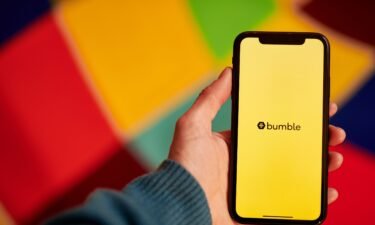 The Bumble logo shown on a smartphone. Bumble is doing away with the requirement that women message potential matches first.