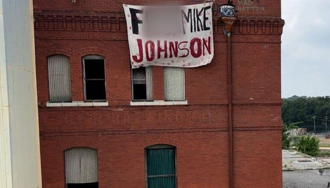 <i>KTBS via CNN Newsource</i><br/>Shreveport's Democratic Socialists of America (DSA) group targeted Speaker of the House Mike Johnson with a sign with profane language on May 22.