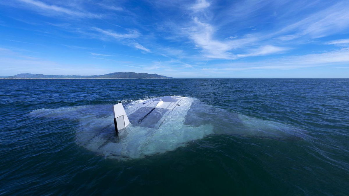 A Manta Ray vehicle sits at the water surface between test dives off the coast of Southern California.
