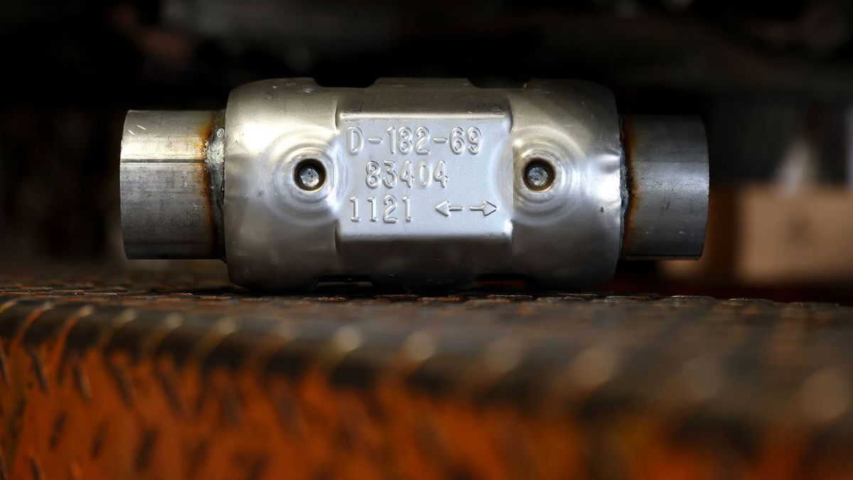 A brand new catalytic converter sits on a car lift in July 2022 in San Rafael, California. Last year, thieves stole 27,609 catalytic converters in the US.
