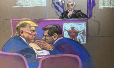 Former President Donald Trump whispers to attorney Todd Blanche during a gag order hearing on May 2. Examples of social media were being shown.