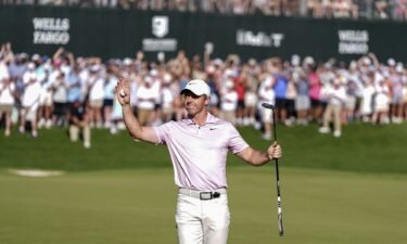 Rory McIlroy celebrates with the trophy after winning the 2024 Wells Fargo Championship at Quail Hollow Club in Clifton