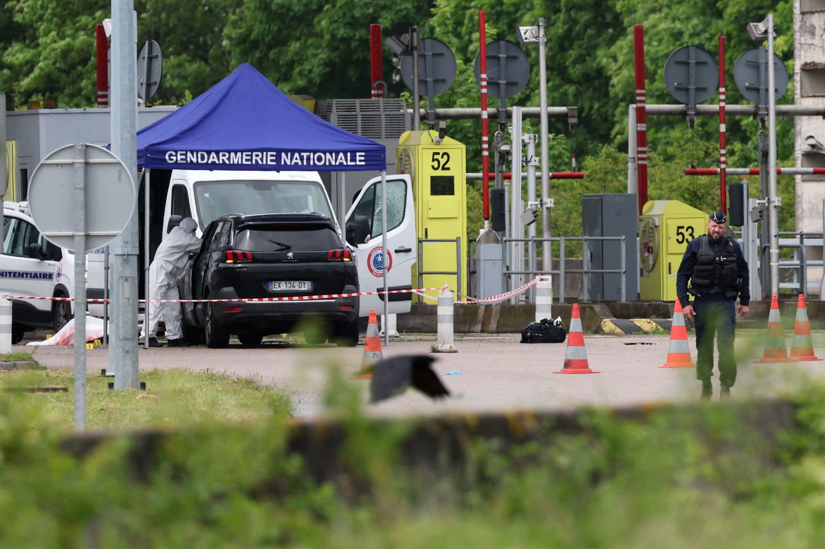 <i>Alain Jocard/AFP/Getty Images via CNN Newsource</i><br/>A forensics team inspects the site of a prison convoy ambush in France on Tuesday in which two guards were killed.